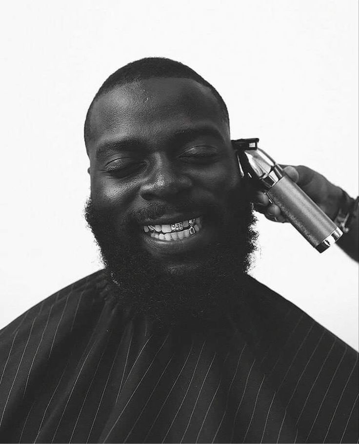 Client smiling during a clipper cut